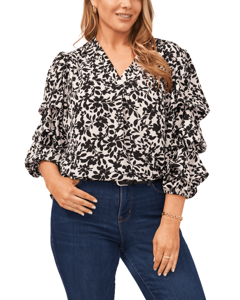Front of a model wearing a size 1X Skylar Flutter Sleeve Tunic in 103-NEW IVORY by Vince Camuto. | dia_product_style_image_id:274287